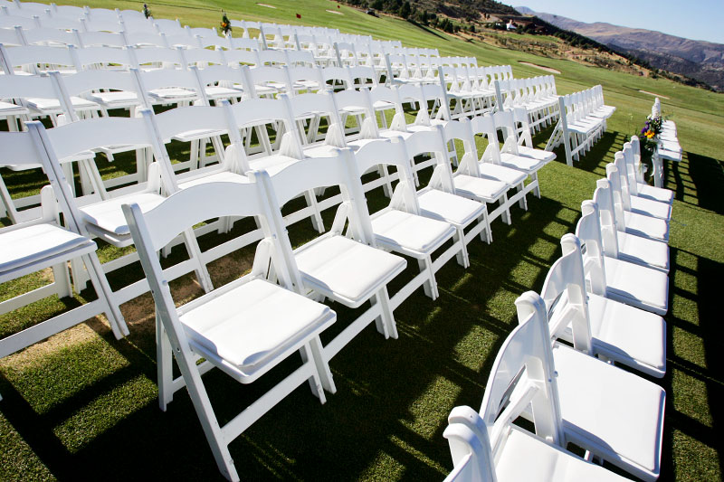white padded folding chair