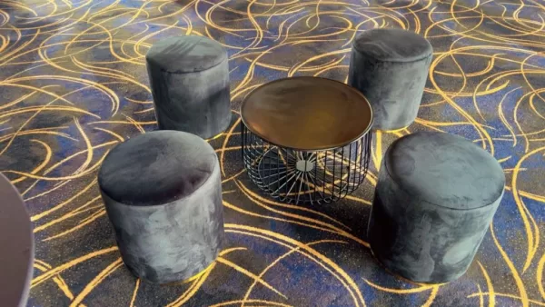 black ottoman stool hire and black wire coffee table hire