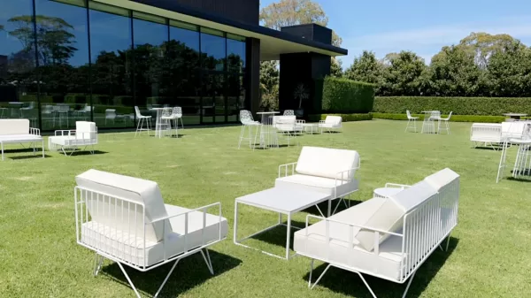 white velvet arm chair and sofa lounge outdoors